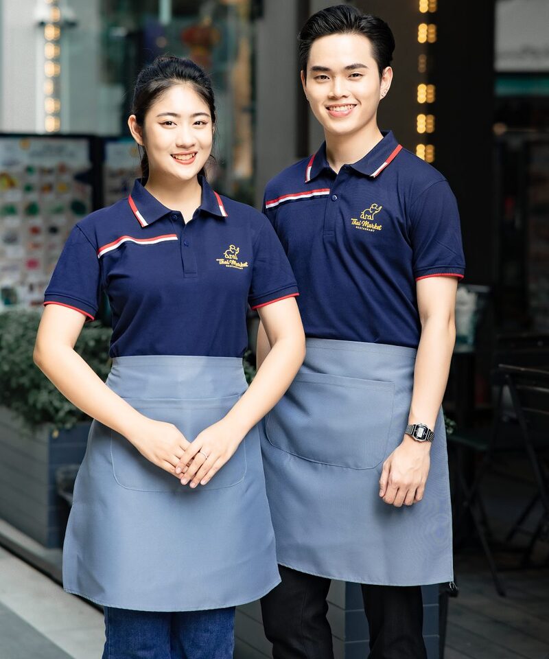Mẫu đồng phục polo xanh than với viền đỏ cách điệu